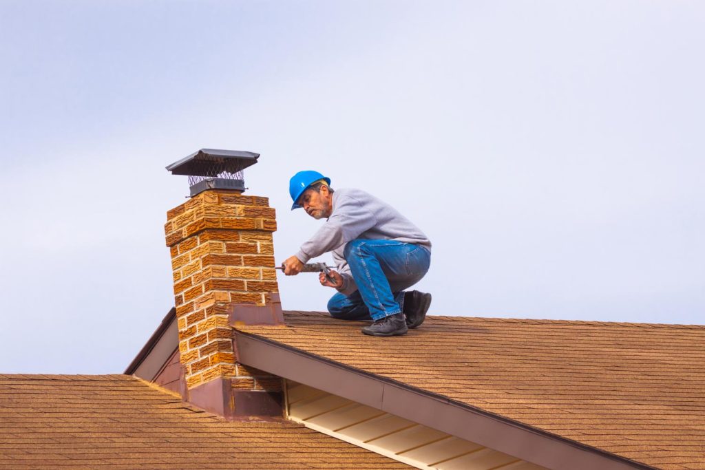 Man repairing chimney