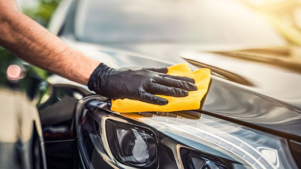 Man wiping car exterior