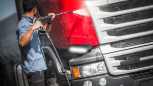 Man Pressure Washing Truck