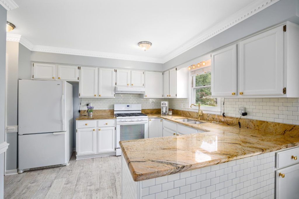 Marble Countertop And White Cabinets