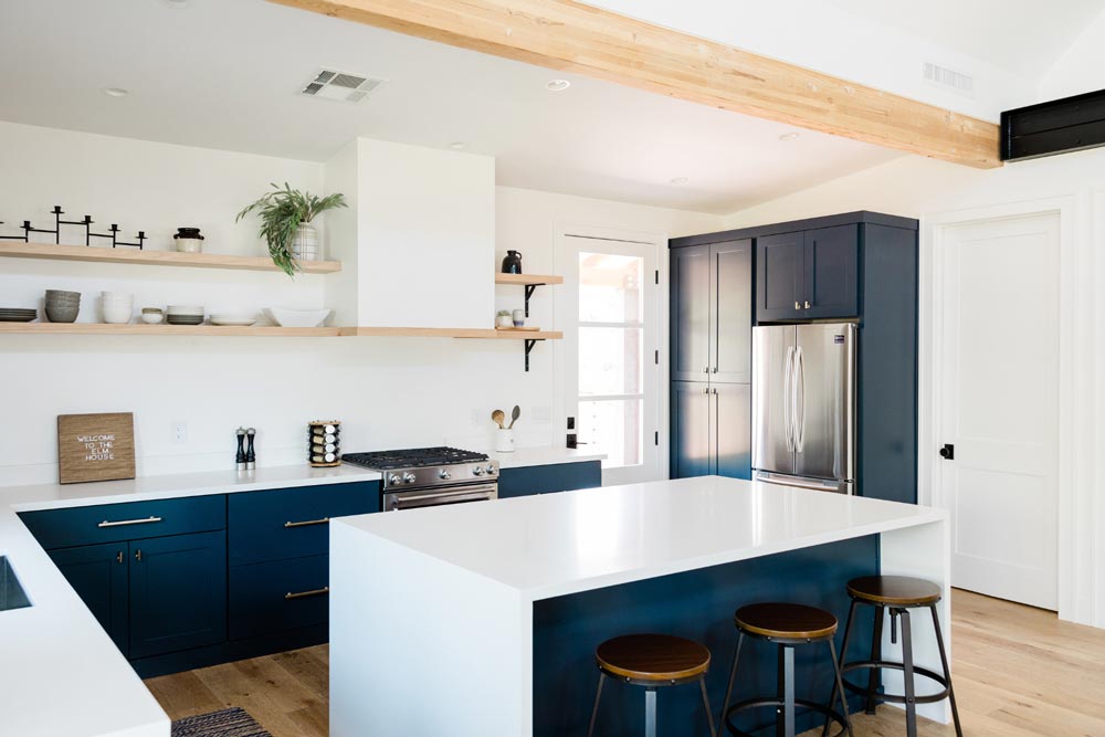 White Countertop and Blue Cabinets